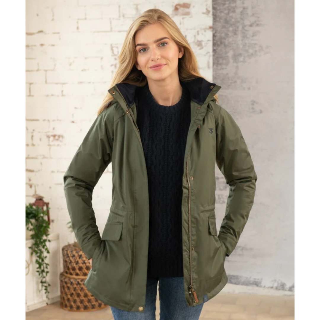 Model wearing Kendal Waterproof Jacket olive green open over a navy sweater with hood lined in plaid