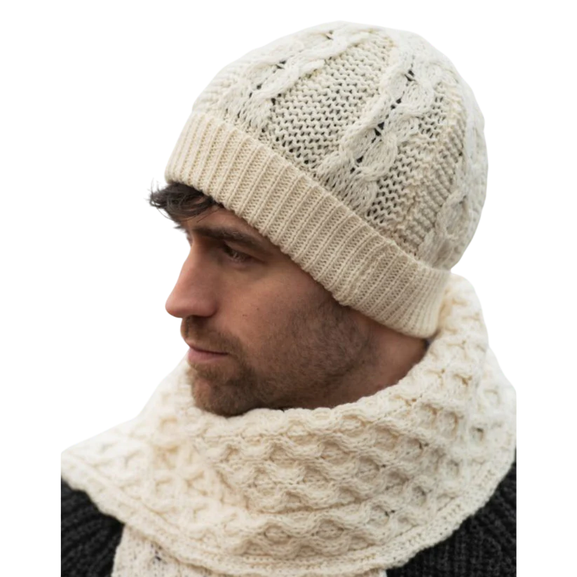Man wearing a natural white Merino wool honeycomb knit hat and matching scarf