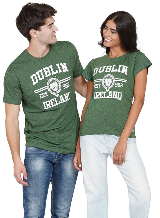 Man and woman smiling wearing matching green Dublin Ireland t-shirts