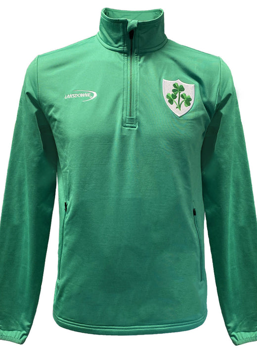 Green men's performance top with zip collar and shield shamrock crest on chest