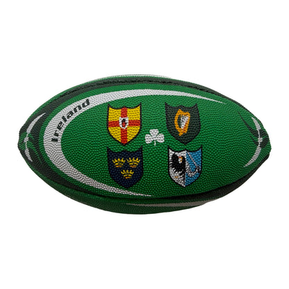 Rugby ball displays four province crests on a green background with shamrock motif
