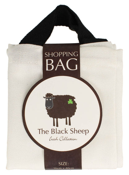 Cream canvas tote bag with black handles and a large round sheep emblem on the front