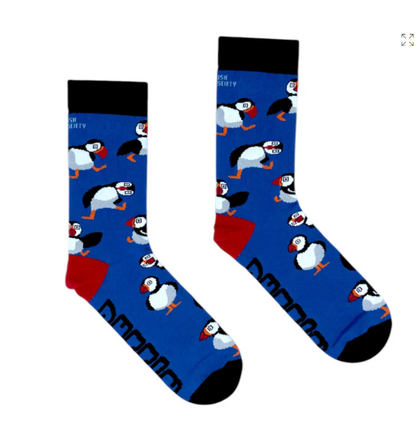 Pair of blue adults puffin socks with repeating puffin illustrations and black cuffs