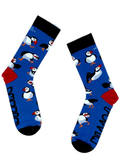 Pair of blue puffin socks for adults with black cuffs and toes and repeating puffin designs
