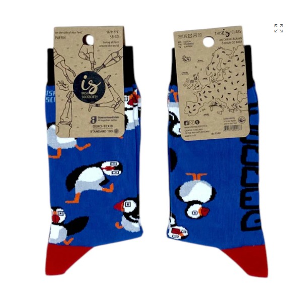 Blue adults puffin socks with white puffins and orange beaks, tag attached.
