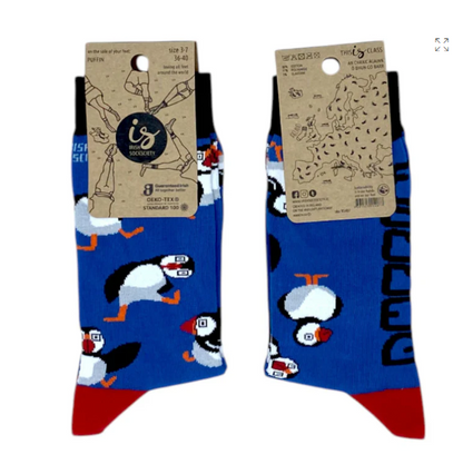 Blue adults puffin socks with white puffins and orange beaks, tag attached.