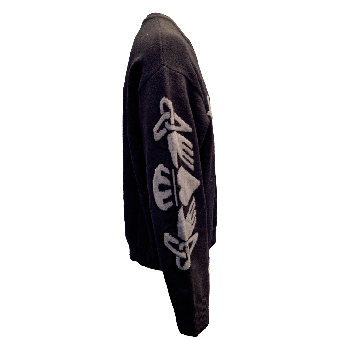 Side view of a black and grey sweater with a white Celtic knot pattern on the sleeve