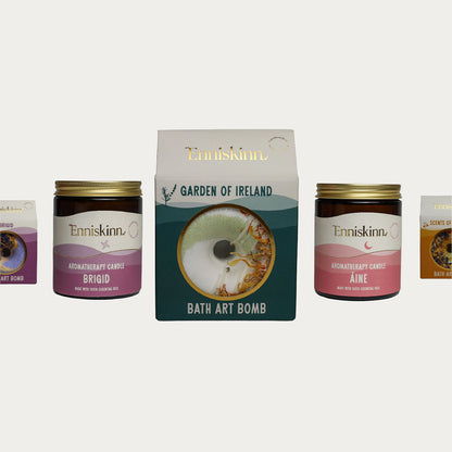 Enniskinn Garden of Ireland Bath Art Bomb gift set with a central box and two jars of aromatherapy candles