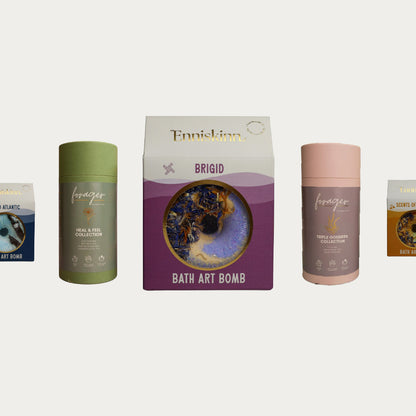 Forager and Enniskinn bath set featuring Brigid Bath Art Bomb centered between green and pink bottles