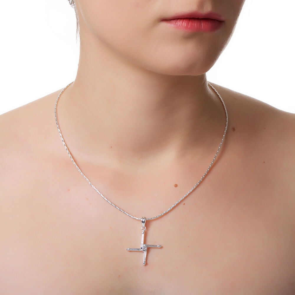 Model wearing a silver St Brigids Cross necklace